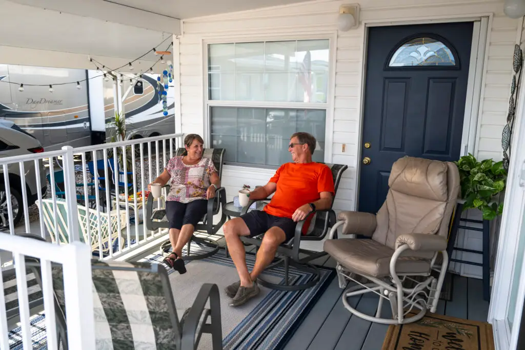 Retired couple relaxing together on their front porch