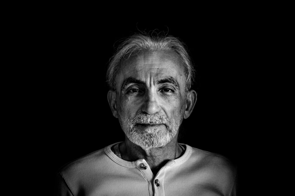 Black and white portrait of an older man weighing up his retirement options
