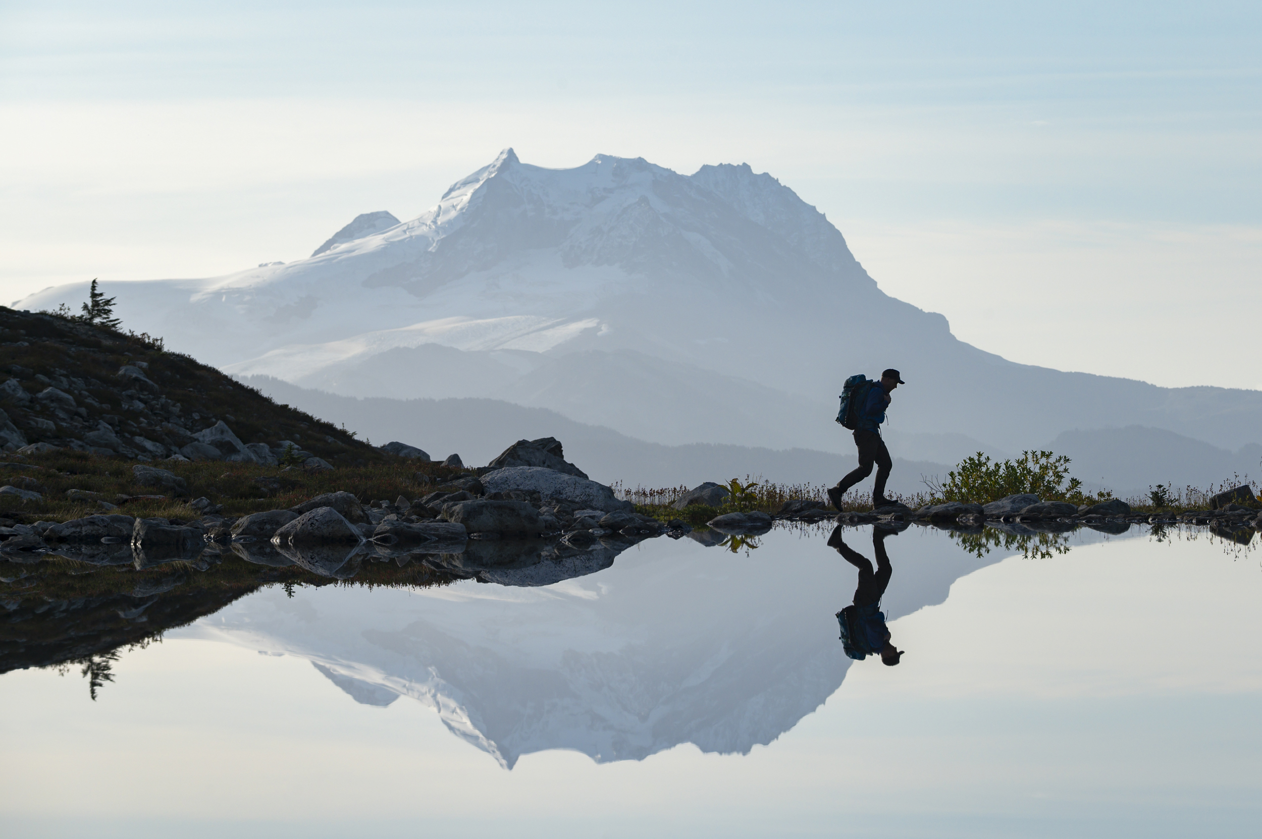 Man sitting alone at sunrise, thinking through a retirement built with little or no savings